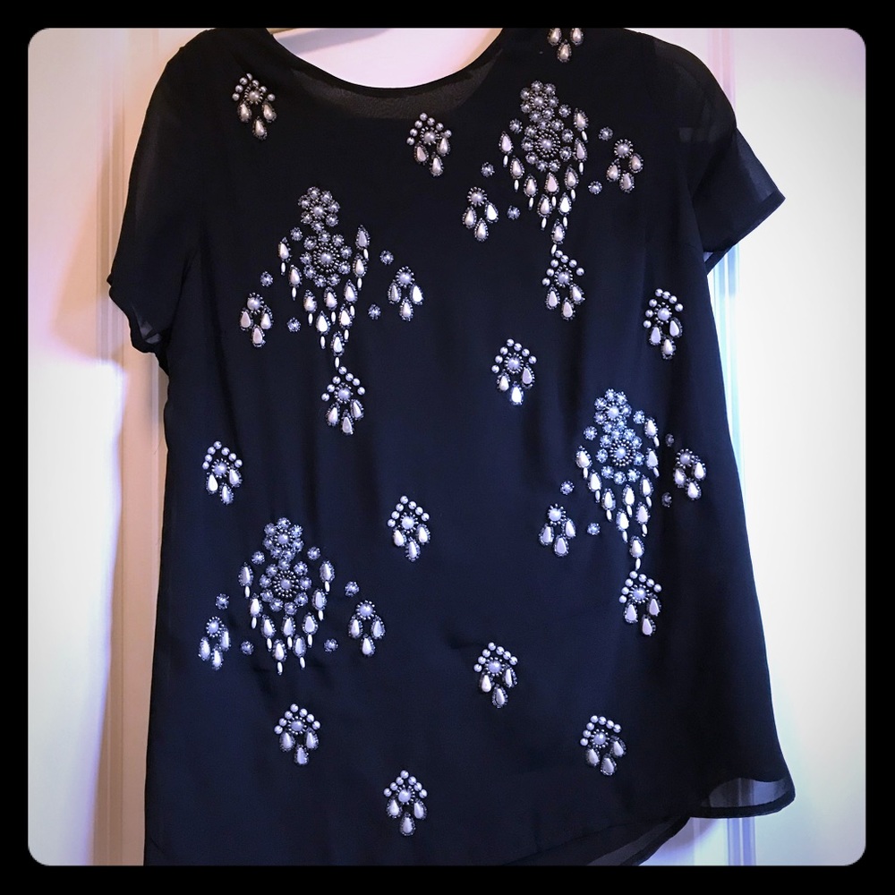 Fancy black blouse with pearl designs.